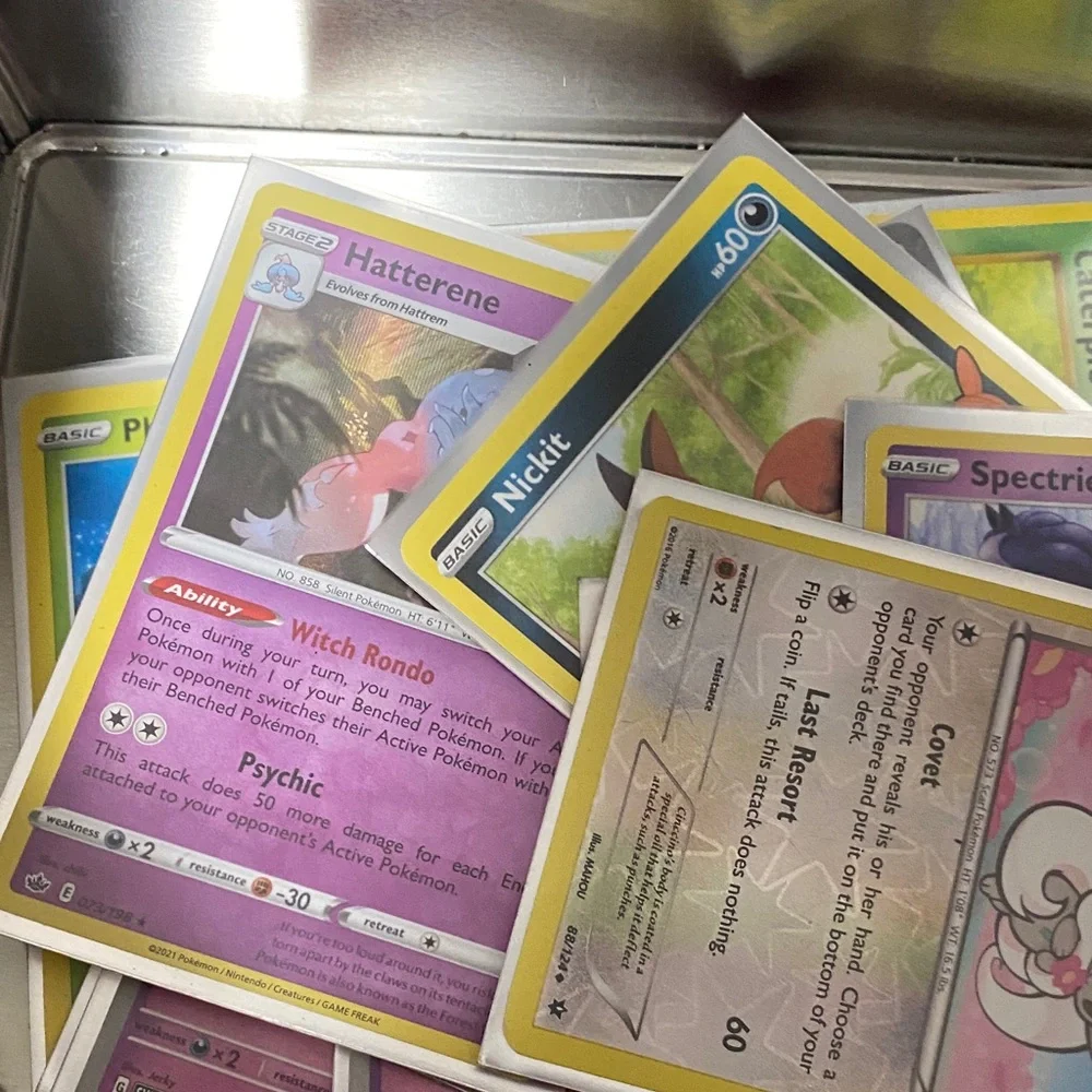 Pokemon Pikachu Yellow and Black Card Tin filled with cards and Pokémon pin